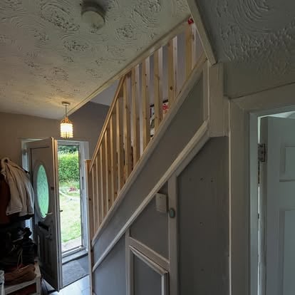 Completed new pine balustrade in hallway