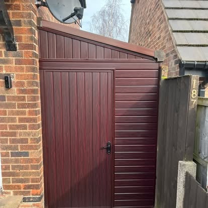 Dark rosewood composite side gate at brick house