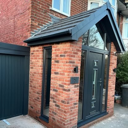 New apex porch exterior with dark cladding and slate roof