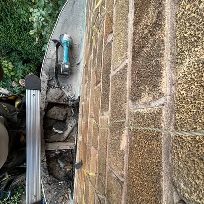 Old felt roof flashing repair with angle grinder