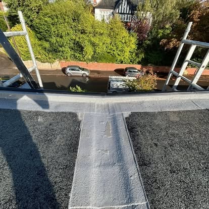 Flat roof viewed from scaffolding looking down