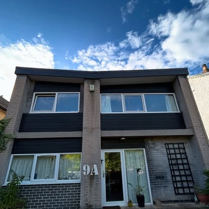 House 9A with dark cladding, street view