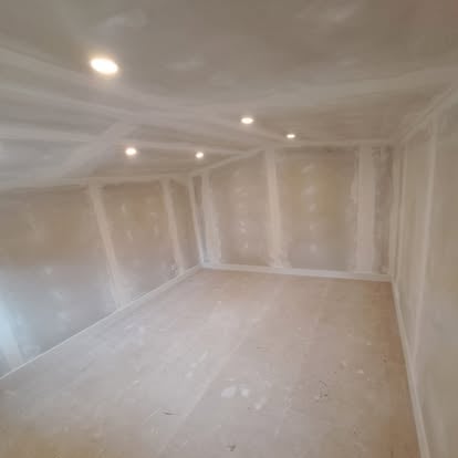 Plastered interior with recessed downlights