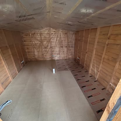 Timber building interior being insulated