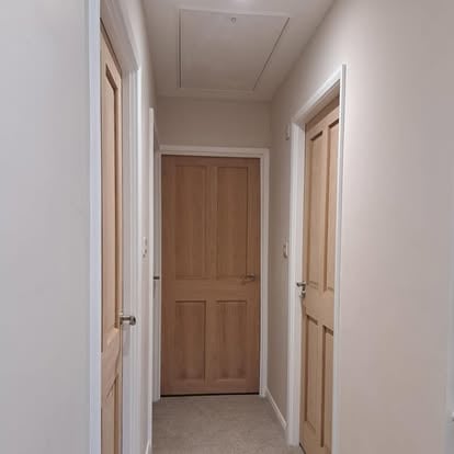 Oak 4-panel internal doors in hallway