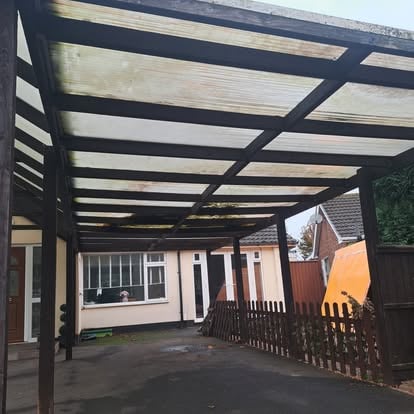 Steel-framed carport with polycarbonate roof panels