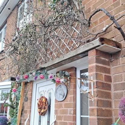 House exterior before canopy, old timber trellis
