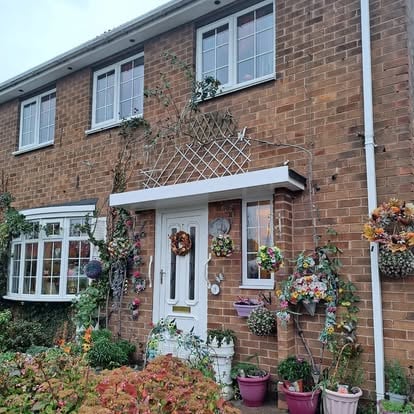 Completed door canopy with summer flower displays
