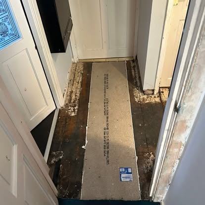 Hallway with new plywood subfloor sheet laid