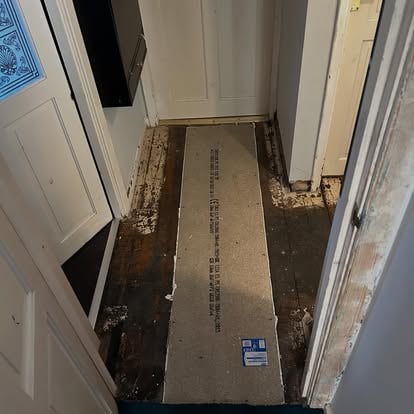 Hallway subfloor replacement, new ply on old boards