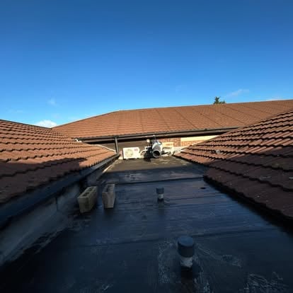 Flat roof during GRP installation, blue sky