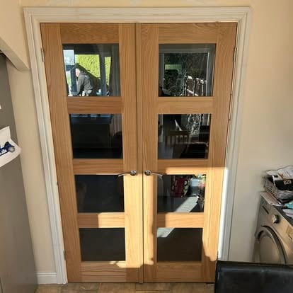 Pair of oak glazed French doors fitted in doorway