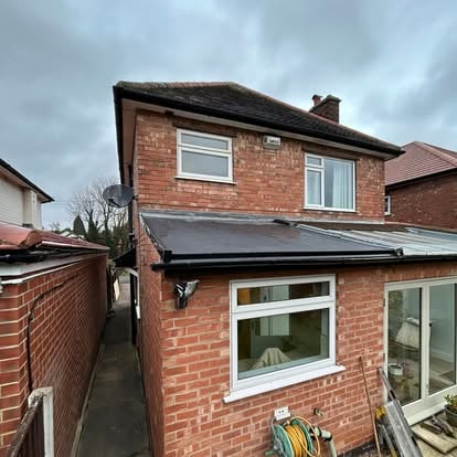 Completed EPDM flat roof on brick house extension