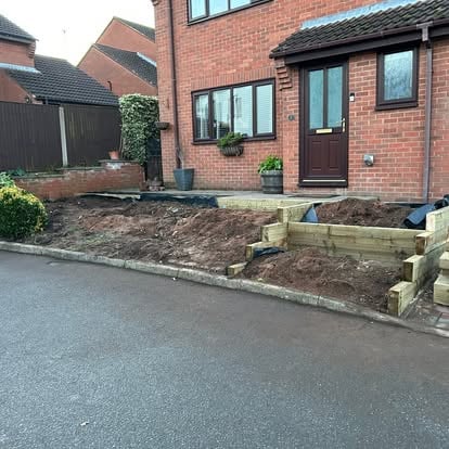 Front garden sleeper frames being set, early stage
