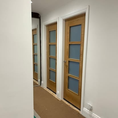 Hallway with three oak frosted-glazed internal doors