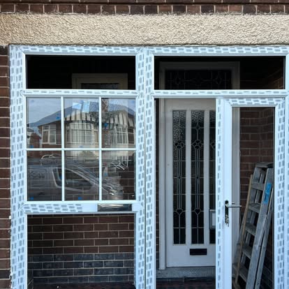 House 48 before, old teal timber windows in opening