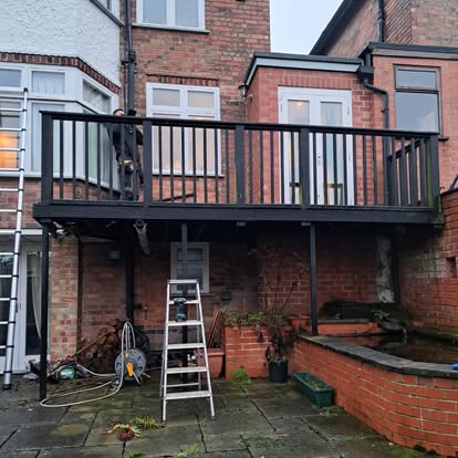 Completed elevated deck with black metal balustrade