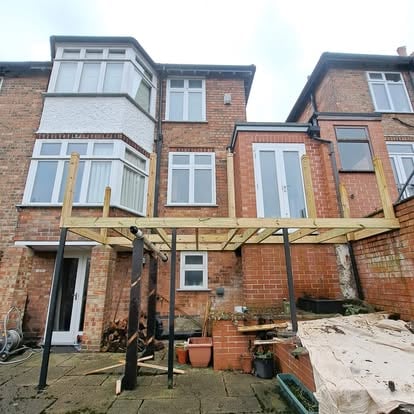 Elevated deck frame, steel posts and timber joists