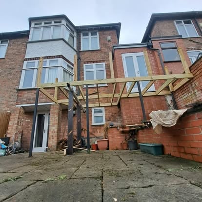 Elevated deck frame with timber joists partially boarded