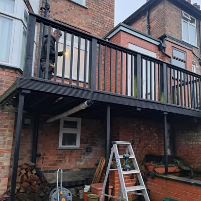 Elevated deck with black metal balustrade