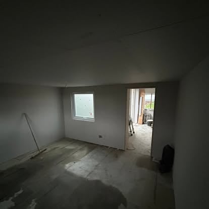 Garden room interior plastered with strip window
